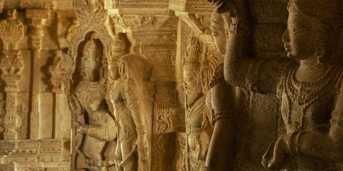 Ancient stone carvings depicting dancers in an Indian temple