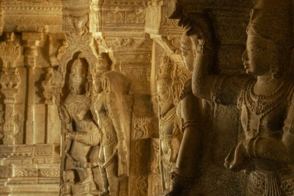 Ancient stone carvings depicting dancers in an Indian temple