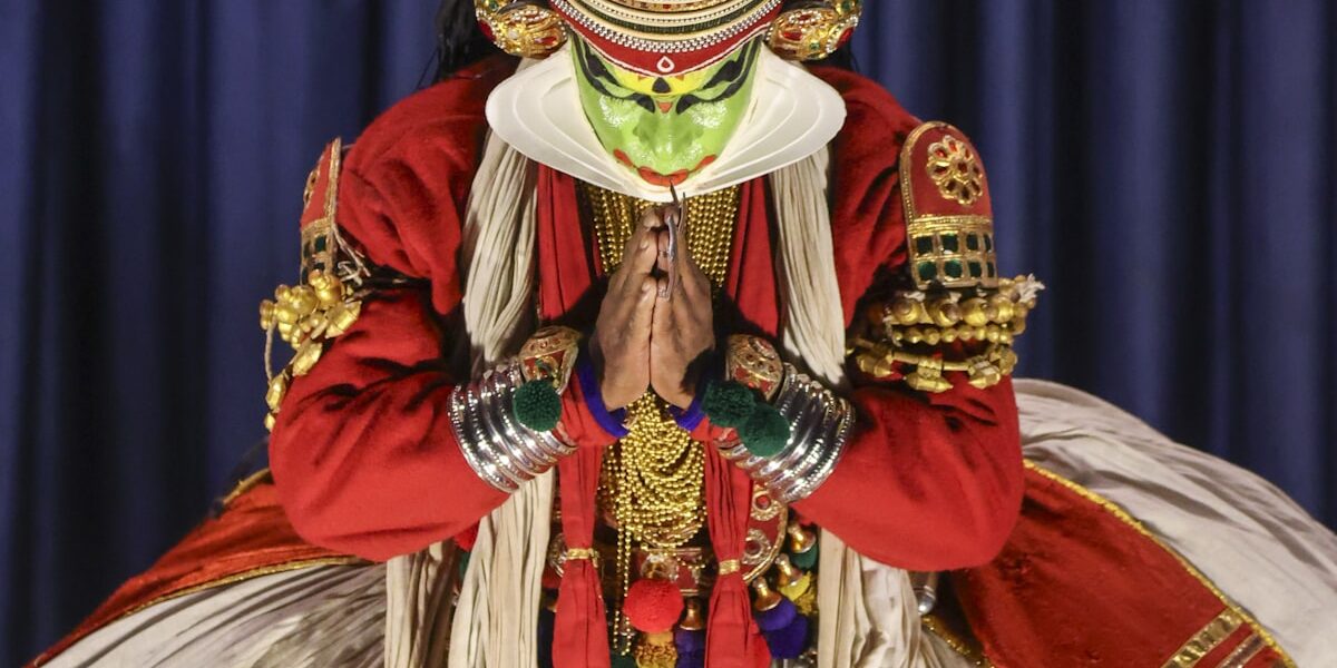 Kathakali dancer in full costume performing traditional Indian theater