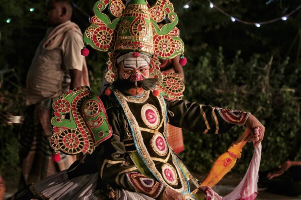 Therukoothu street theater performer in elaborate costume and headdress